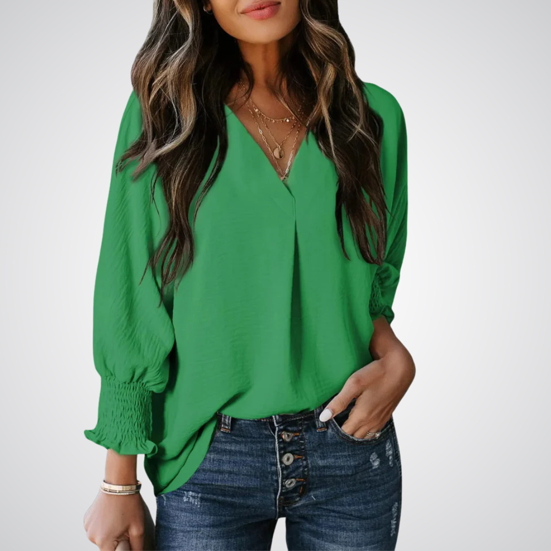 Green V-neck tunic blouse with button front and smocked long balloon sleeves
