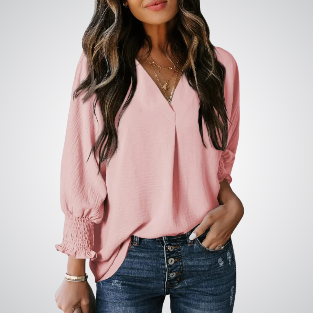 Blush pink V-neck tunic blouse with button front and smocked long balloon sleeves