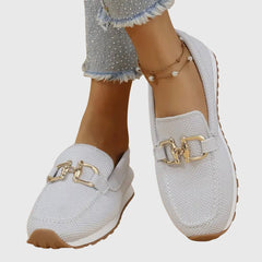 White orthopedic loafer sneakers with gold-tone buckle detailing and cushioned lining