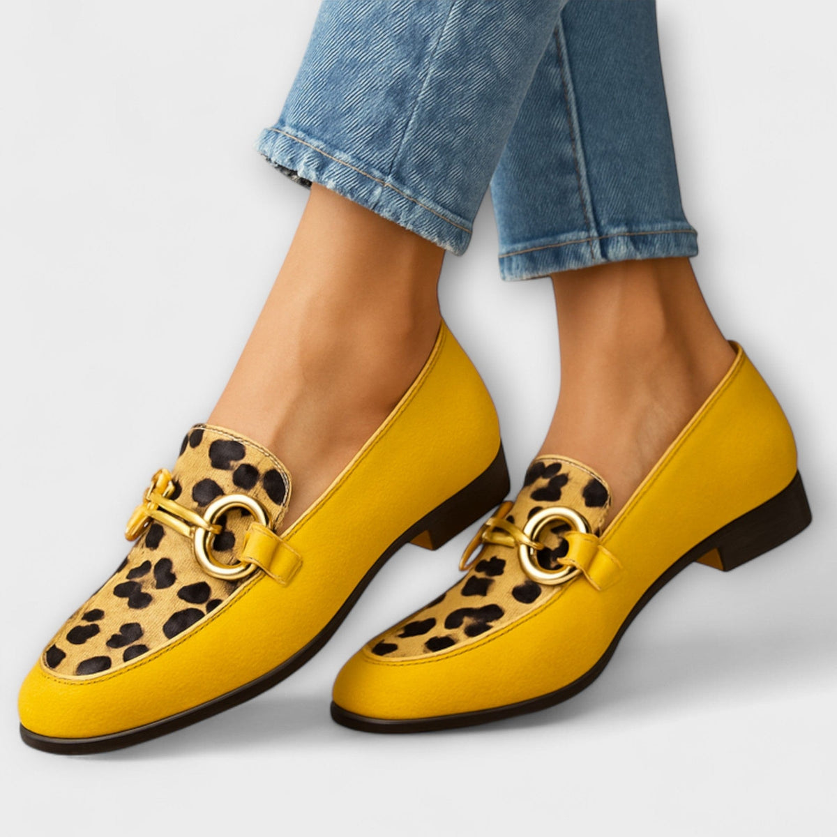 Yellow slip-on slippers with leopard-print detail and gold buckle strap