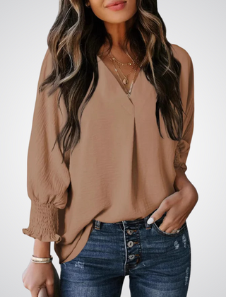 Tan V-neck tunic blouse with button front and smocked long balloon sleeves