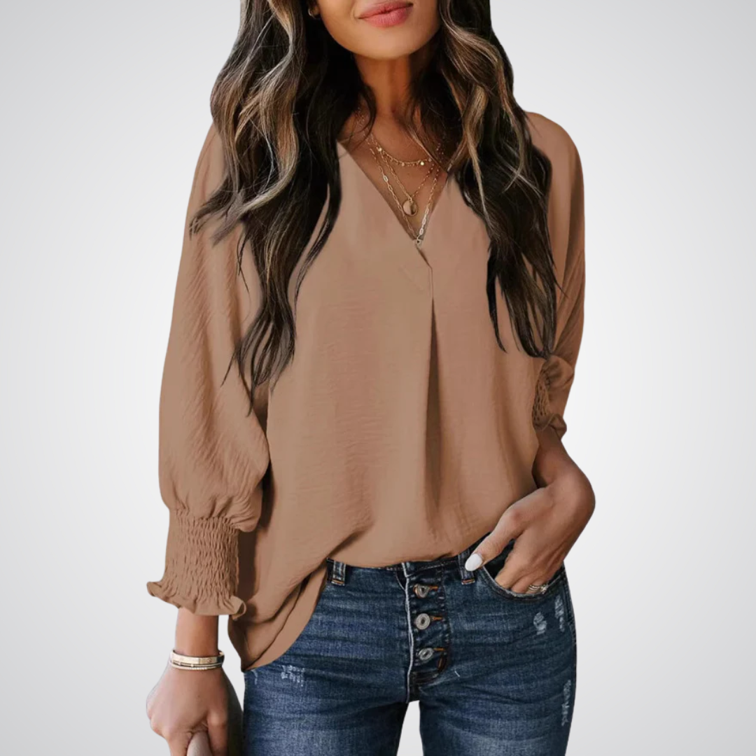 Tan V-neck tunic blouse with button front and smocked long balloon sleeves