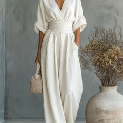 White V-neck high-waisted jumpsuit with gathered waist and wide-leg trousers