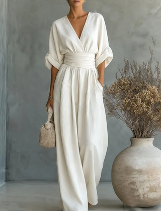 White V-neck high-waisted jumpsuit with gathered waist and wide-leg trousers