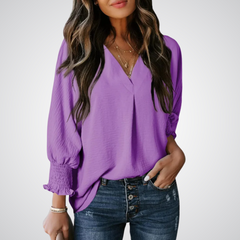 Lavender V-neck tunic blouse with button front and smocked long balloon sleeves