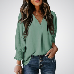 Teal green V-neck tunic blouse with button front and smocked long balloon sleeves