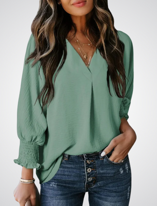 Teal green V-neck tunic blouse with button front and smocked long balloon sleeves