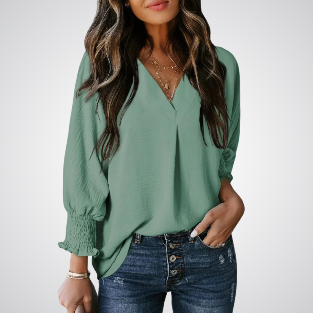 Teal green V-neck tunic blouse with button front and smocked long balloon sleeves