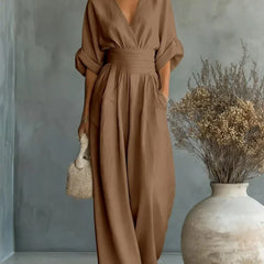 Taupe V-neck high-waisted jumpsuit with gathered waist and wide-leg long pants