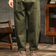 Army green cargo pants with side pockets and relaxed straight legs