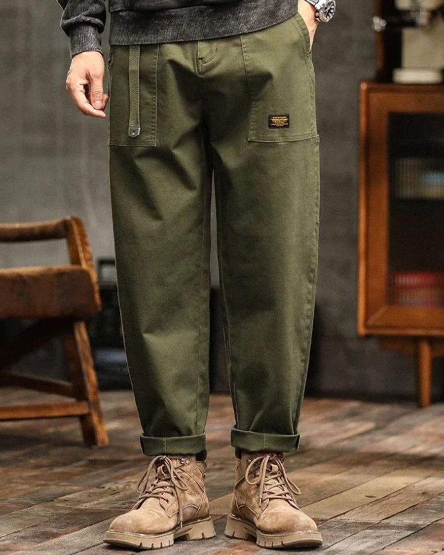 Army green cargo pants with side pockets and relaxed straight legs