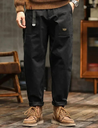 Black cargo pants with side pocket and elastic cuffed ankle hem