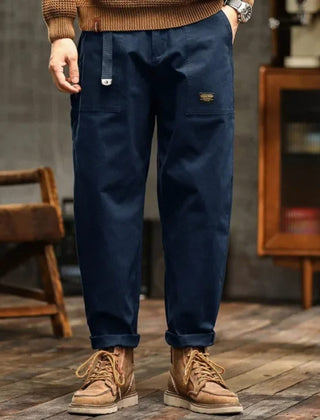 Navy blue cargo pants with thigh cargo pocket and cuffed ankle hem