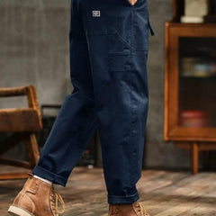 Navy blue cargo pants with thigh pocket and cuffed ankle hem