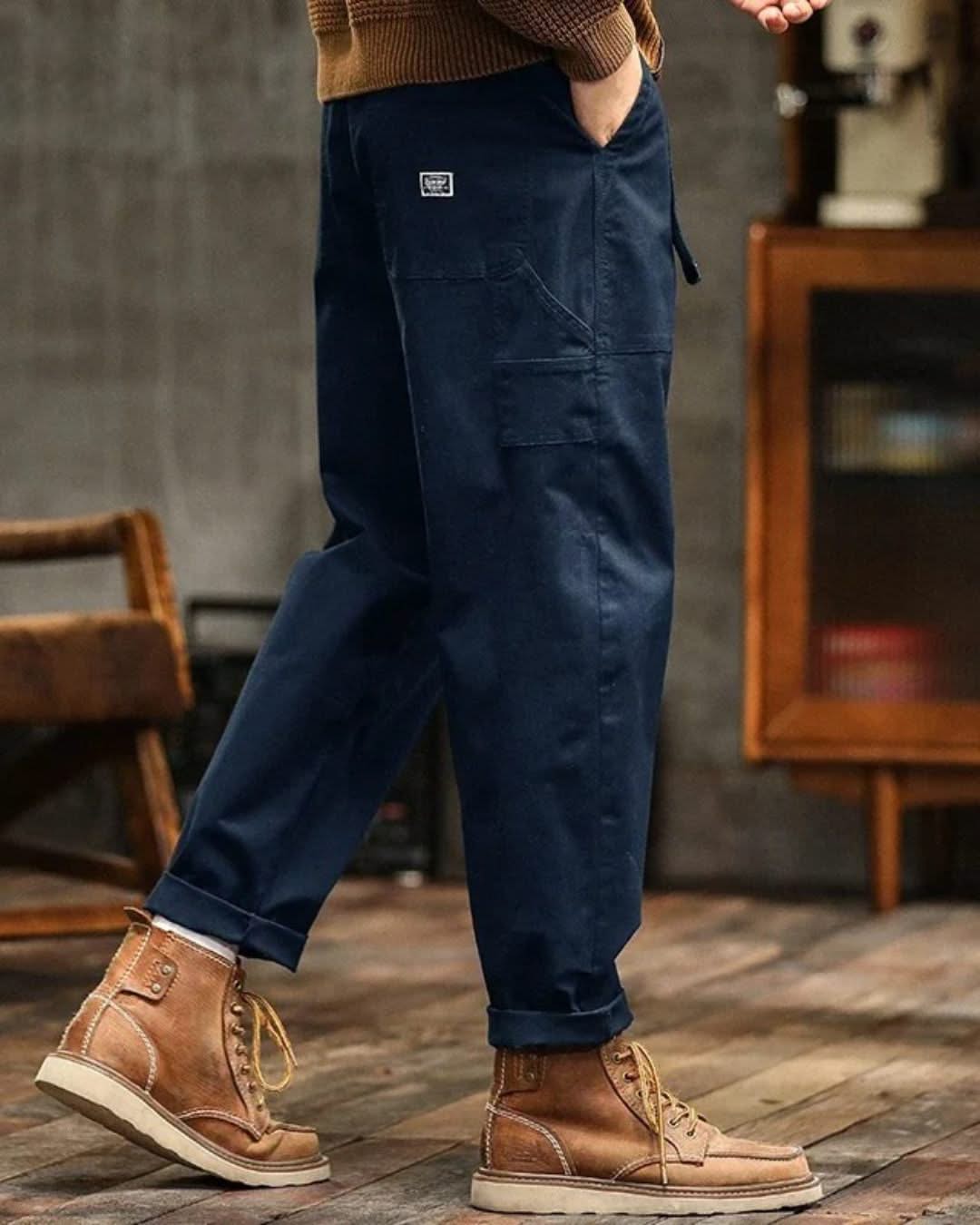 Navy blue cargo pants with thigh pocket and cuffed ankle hem