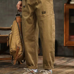 Khaki cargo pants with side cargo pocket, drawstring hem, and ankle cuffs