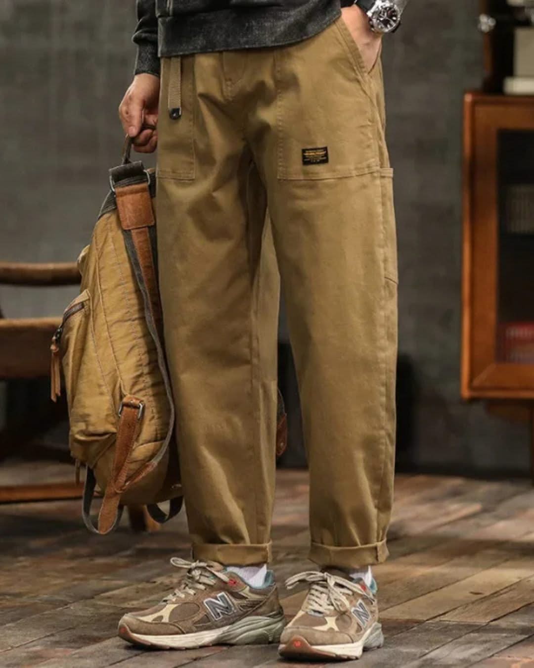 Khaki cargo pants with side cargo pocket, drawstring hem, and ankle cuffs