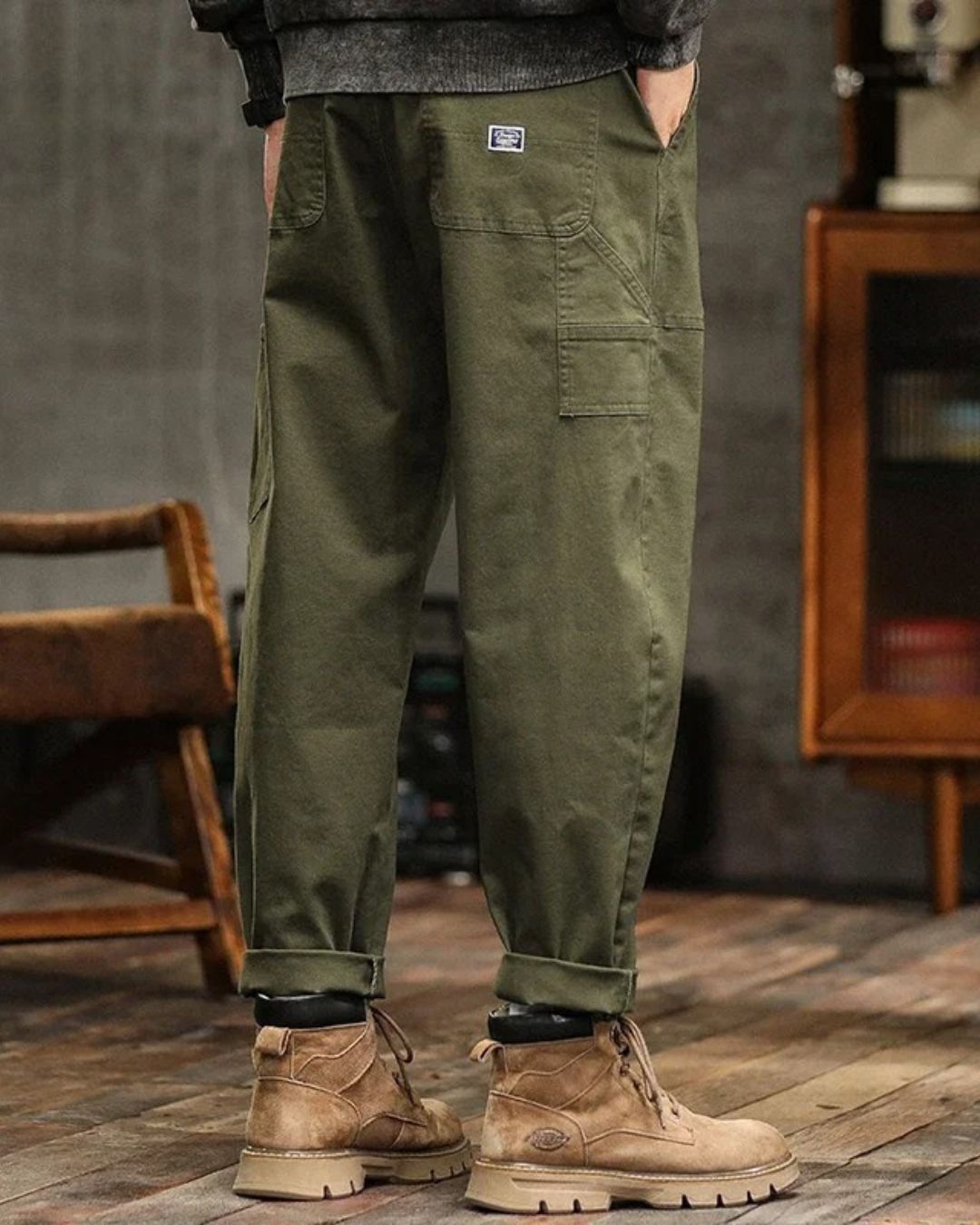 Olive green cargo pants with button fly and cargo pocket on thigh