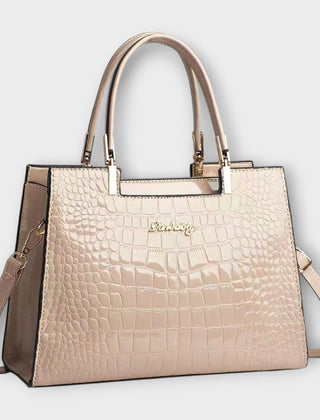 Shiny crocodile-pattern handbag in light khaki with top handles and crossbody strap