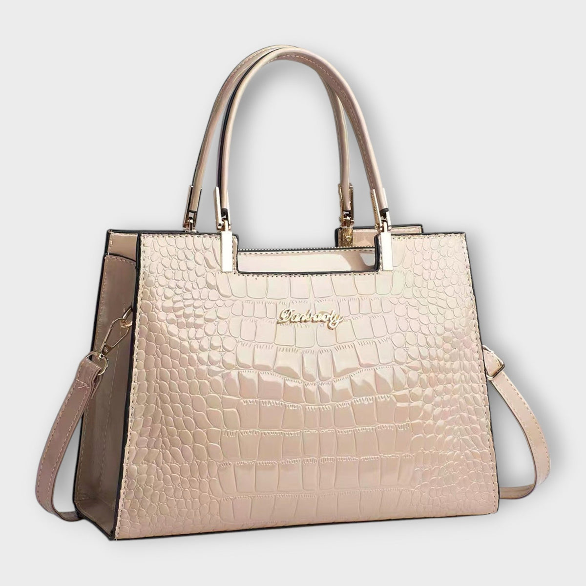 Shiny crocodile-pattern handbag in light khaki with top handles and crossbody strap