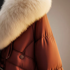 Burgundy puffer coat detail with cream faux-fur trim, snap buttons and zip