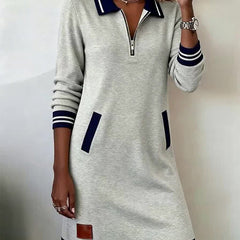 Gray long-sleeve casual dress with half-zip collar, navy stripe cuffs and hem