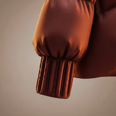 Coffee-brown puffer coat sleeve with elastic cuff and cinched hem