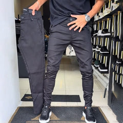 Dark charcoal slim trousers with front button, zip fly, and side pockets