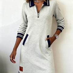 Gray long-sleeve casual dress with half-zip collar and navy striped cuffs and hem