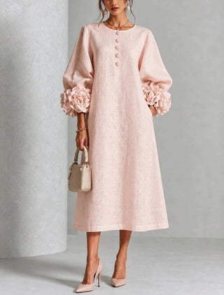 Pink floral midi dress with button front and rose-cuff puff sleeves