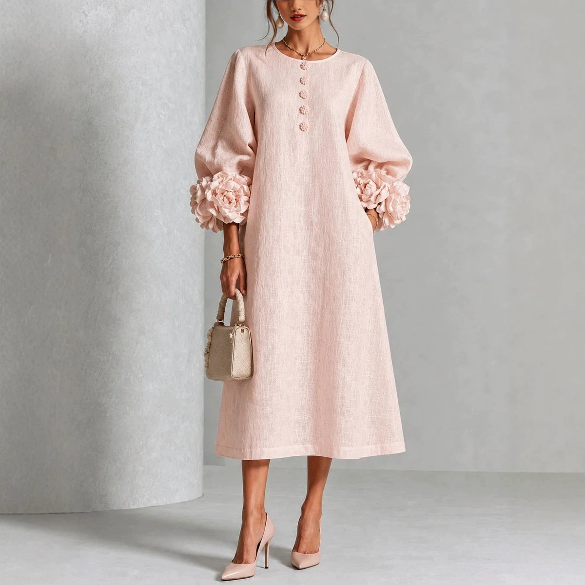 Pink floral midi dress with button front and rose-cuff puff sleeves