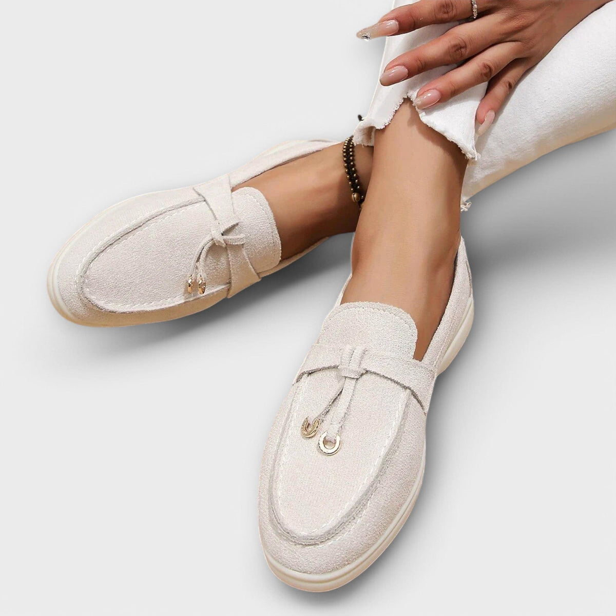 Women's suede loafers, off-white with bow and horsebit ornament, side view