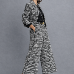 Black-and-white tweed blazer and wide-leg trousers set with gold buckle belt