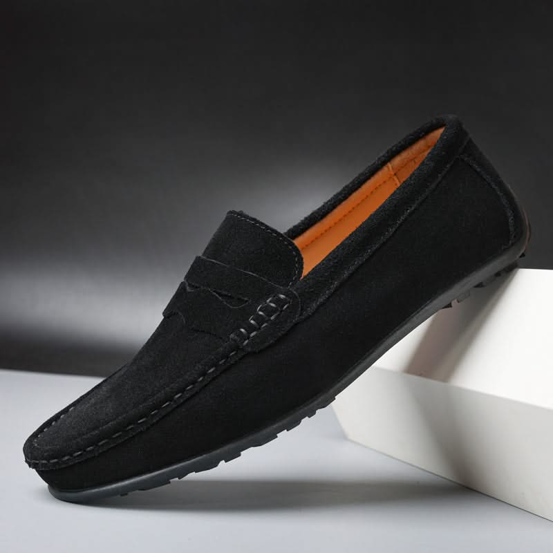 Black suede slip-on loafers with stitched penny strap and moc toe