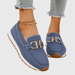 Blue orthopedic loafer sneakers with gold-tone buckle ornament and slip-on design