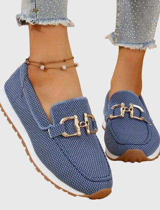 Blue orthopedic loafer sneakers with gold-tone buckle ornament and slip-on design