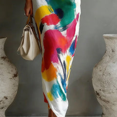 One-shoulder maxi dress close-up, white with colorful abstract brushstroke print