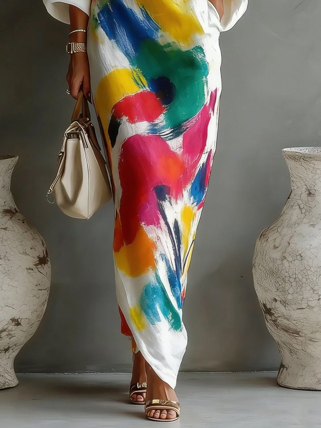 One-shoulder maxi dress close-up, white with colorful abstract brushstroke print