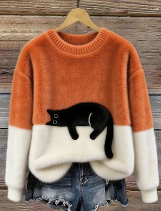 Orange oversized sweater with white hem and cuffs, featuring a black penguin front graphic.