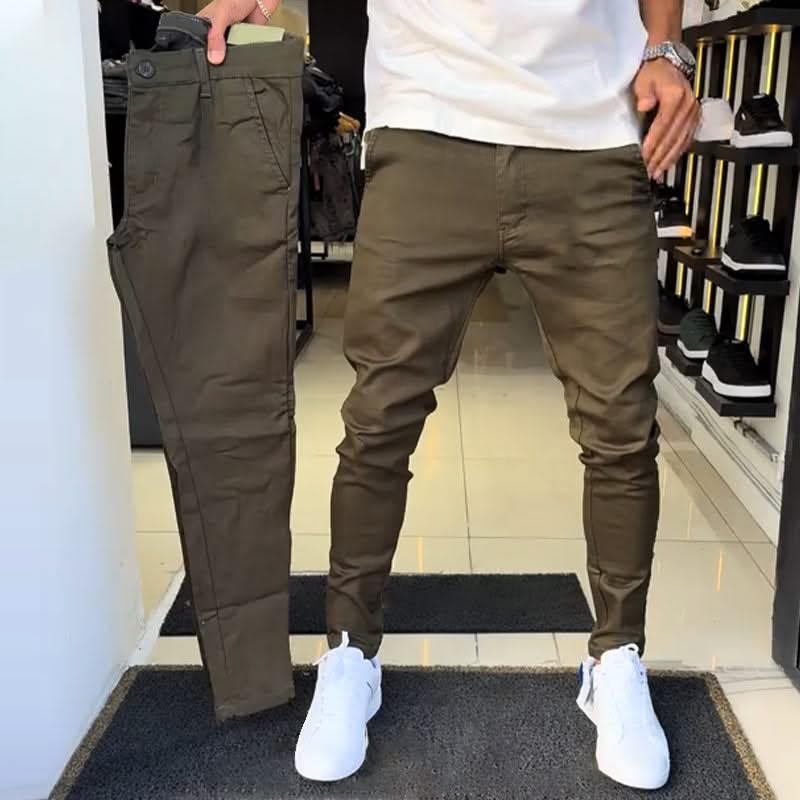 Olive khaki slim trousers with tapered legs, button waist, and side pockets