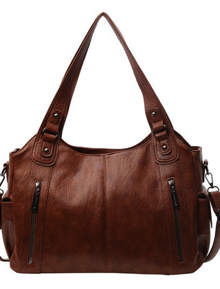 RAE Classic leather handbag, brown with two top handles, zip details, and shoulder strap