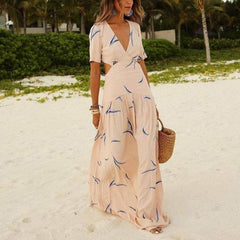 Apricot printed maxi dress with V-neck, short sleeves, tiered flowy skirt
