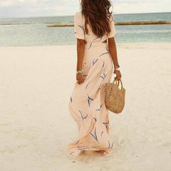 Apricot long wrap-style maxi dress with short sleeves and blue abstract leaf print