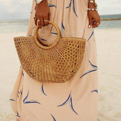 Apricot maxi dress featuring blue abstract print and gathered skirt with tie at waist