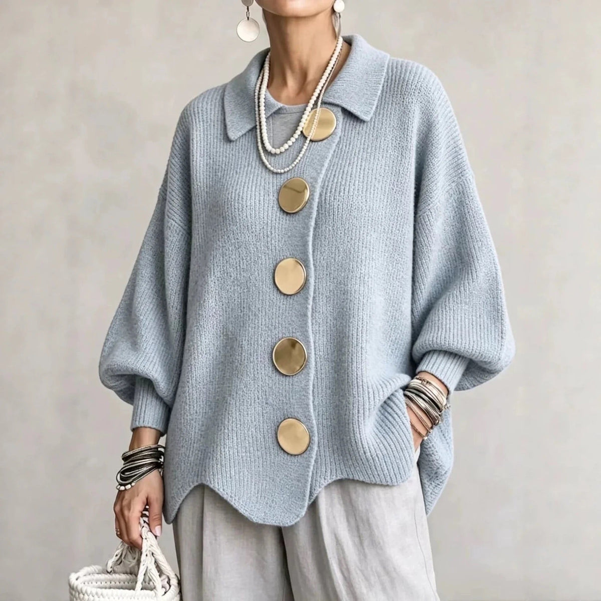 Oversized light blue collared button cardigan with long balloon sleeves and round buttons