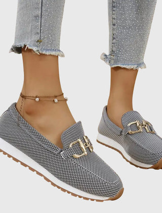 Gray orthopedic loafer sneakers with gold-tone buckle detail and textured fabric upper