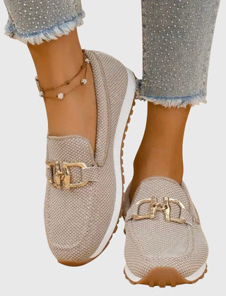 Beige orthopedic loafer sneakers with gold-tone buckle ornament on the vamp