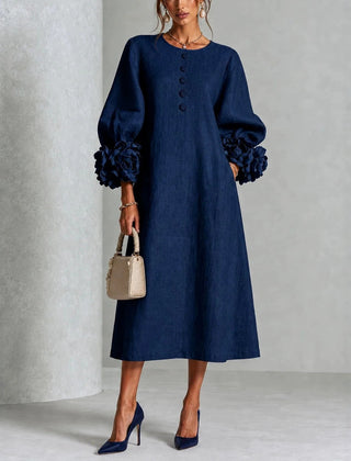 Navy floral midi dress with button front and rose-cuff puff sleeves, full front view