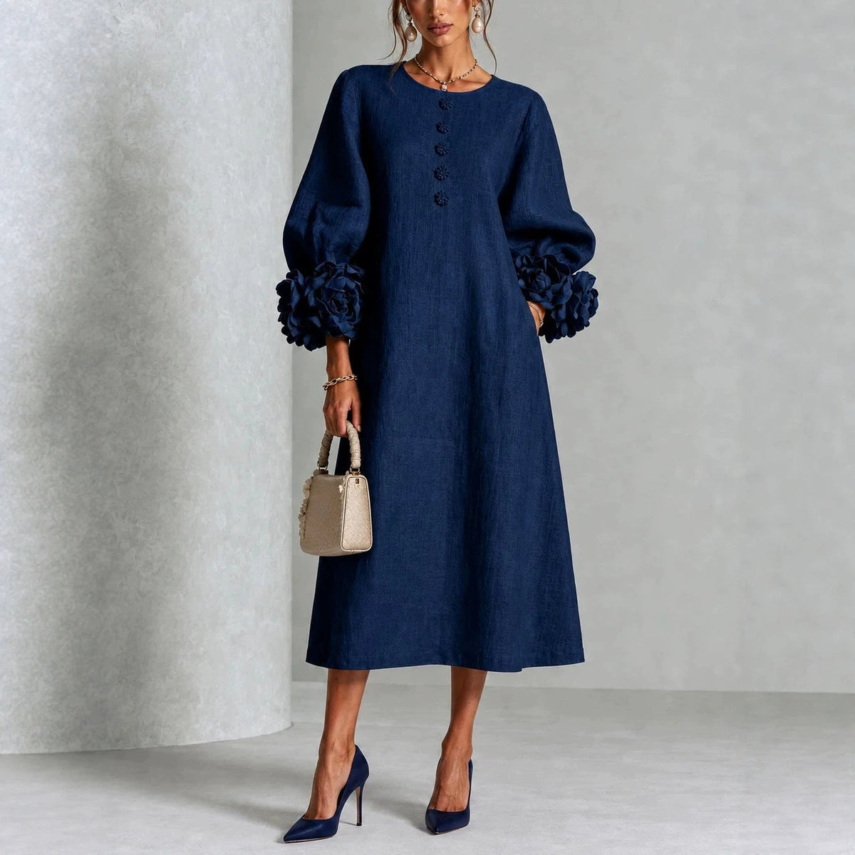 Navy floral midi dress with button front and rose-cuff puff sleeves, full front view