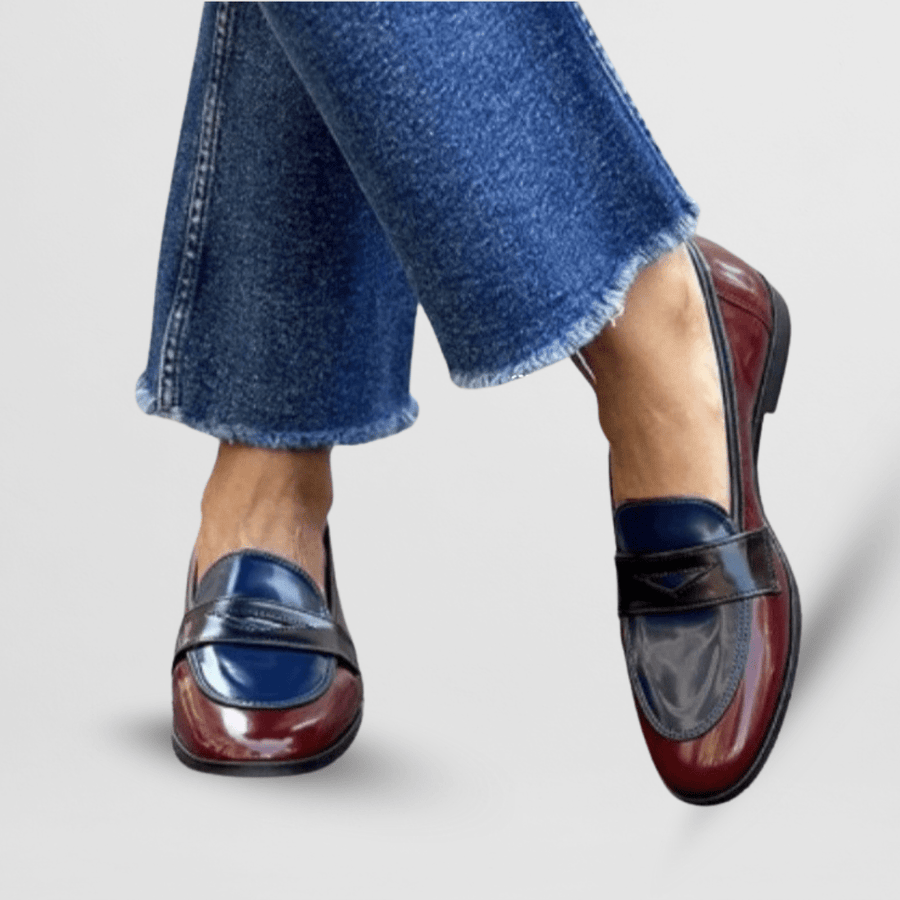 Colorblock loafers with blue uppers, burgundy toe, and strap detail, low heel